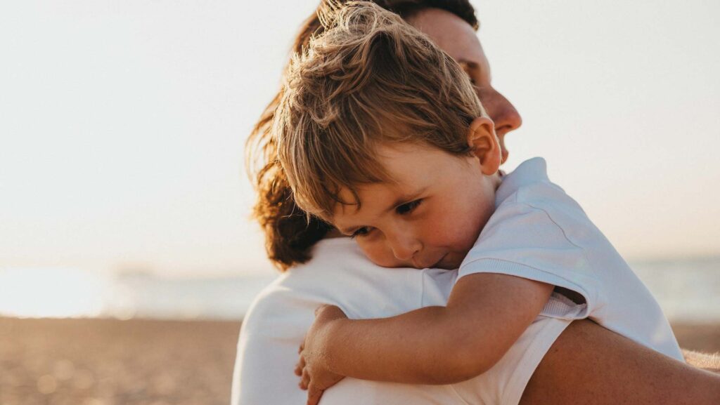 mother hugging son