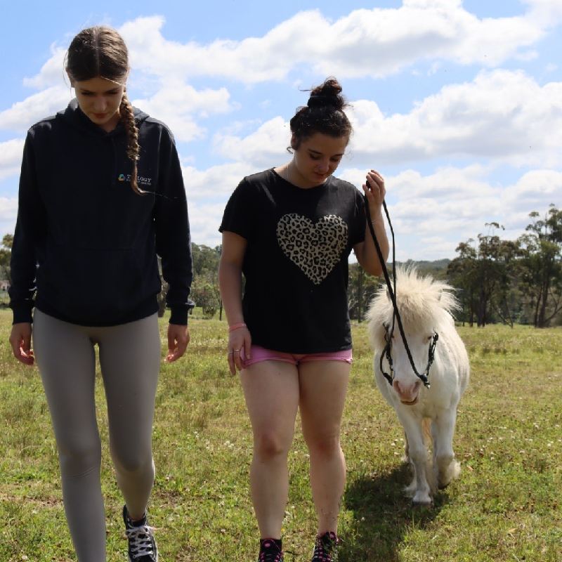 two girls with pony
